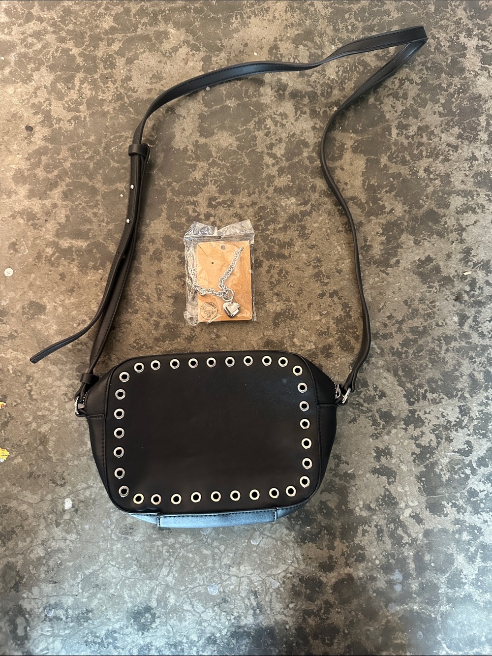 French Connection Grommet Trim Crossbody Bag with matching silver heart necklace